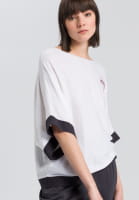 Poncho jumper with stitched badges