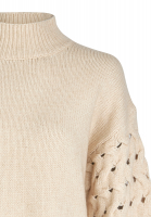 Turtleneck sweater with knitted pattern on sleeve