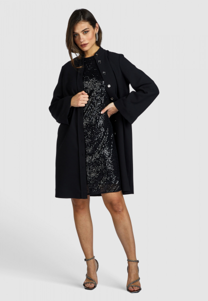 Coat with metallic buttons
