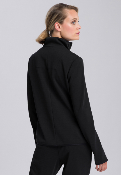 Training jacket with thumbholes at the end of the sleeves