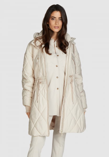 Poncho style quilted jacket