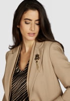 Blazer with faux leather details and brooch