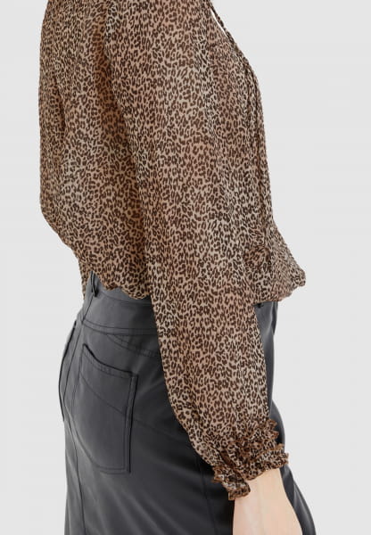 Leopard print blouse with ruffle details