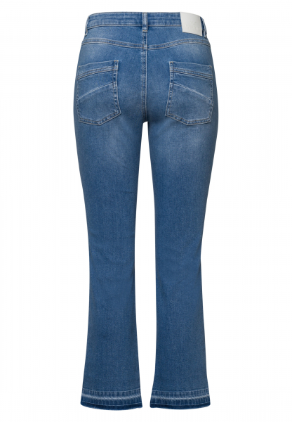 Cropped flared jeans with wash effect at the hem