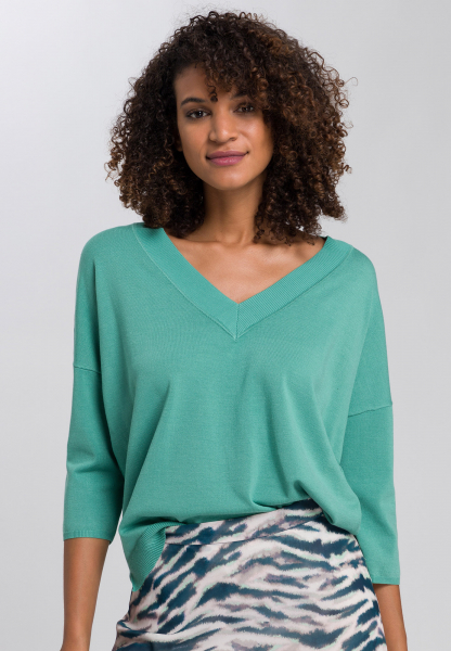 Sweater with shortened sleeves