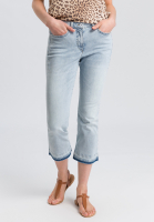 Jeans with frayed seam