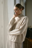 Sweater with beaded appliqué