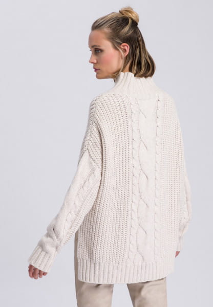 Sweater with longer cut back