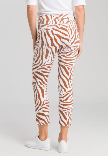 Jeans with tiger-allover pattern