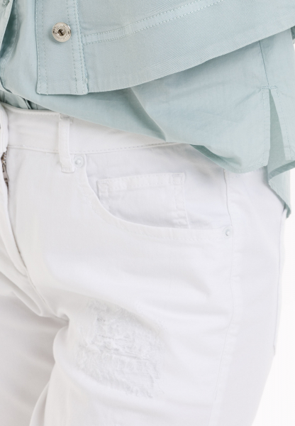 Shorts made from lightweight white denim with destroyed elements