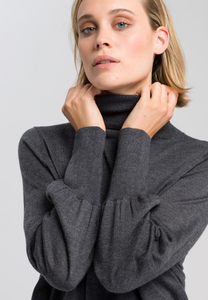 Roll collar jumper with fashionably wide sleeves