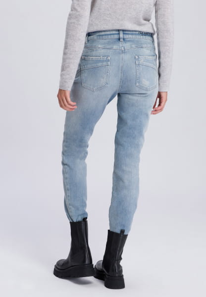 Jeans with distressed effects