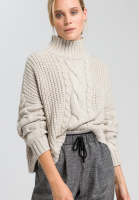 Boxy sweater with cable knit pattern