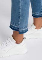 Cropped flared jeans with wash effect at the hem
