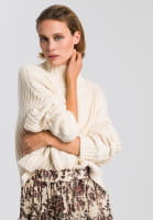 Boxy sweater with cable knit pattern