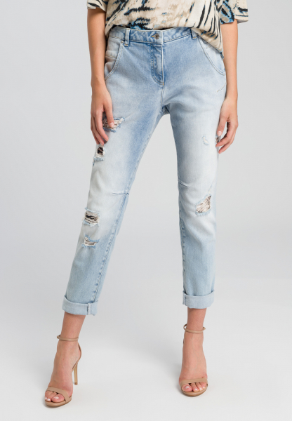 Destroyed jeans made from recycled denim